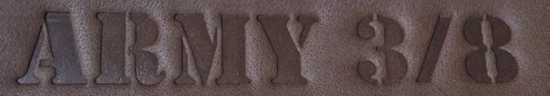 ARMY 3/8 embossed on brown leather: without foil on the left, in silver foil in the middle, in gold foil on the right