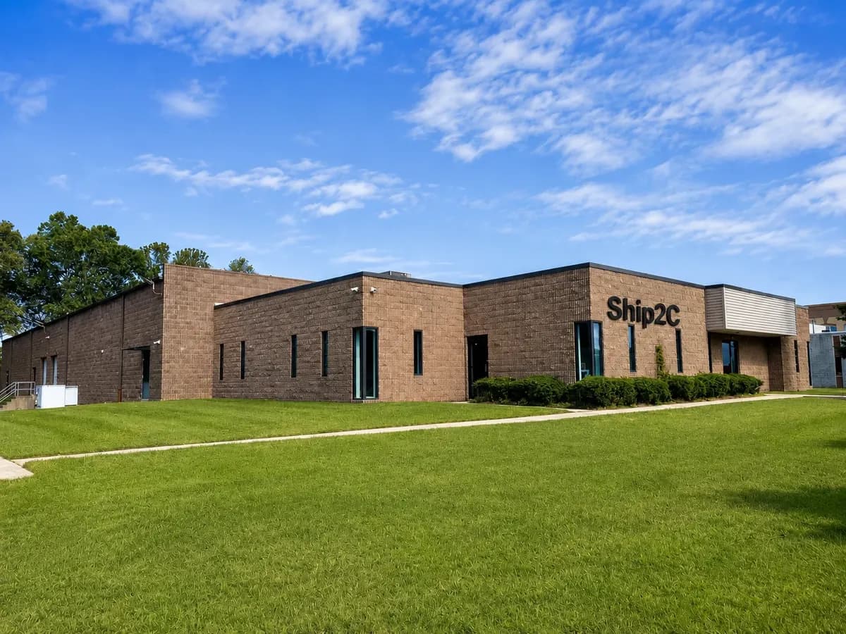 Single-storey brick warehouse building in Philadelphia with a lawn in front